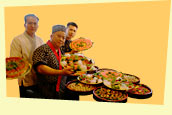 sushi chef and servers with trays of food